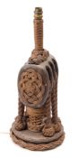 An oak triple block converted to a table lamp with ropework decoration on a circular base:,