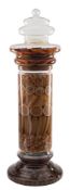 A large early 20th century clear glass shop display jar: of cylindrical form with domed cover and
