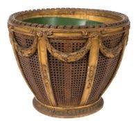A carved giltwood and gesso circular jardiniere:, in the French taste, having a metal liner,