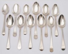 Twelve Georgian silver Old English pattern dessert spoons, marks worn,