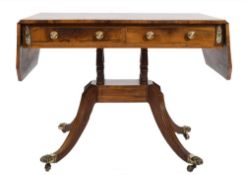 A Regency rosewood and inlaid sofa table:, bordered with boxwood and ebonised lines,