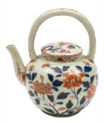 A Japanese Imari teapot and cover: with arched overhead handle,