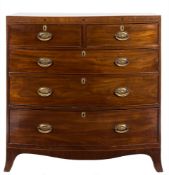 An early 19th Century mahogany and inlaid bow-fronted chest:,