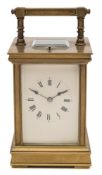 A Victorian brass carriage clock: the eight-day duration movement having a platform lever