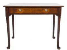 An 18th Century oak rectangular side table:, the overhanging top with a moulded edge,