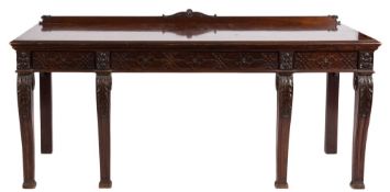 An Edwardian carved mahogany rectangular serving table in the Chippendale taste:,