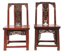 A pair of Chinese red lacquered, carved and decorated side chairs:,