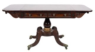A Regency carved rosewood and brass inlaid sofa table:,