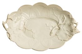 A Chelsea white two-handled basket weave oval dish: applied with vine leaves and twigs, circa 1755,
