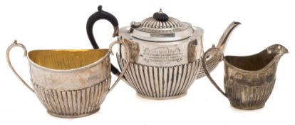 A Victorian silver three-piece tea service, maker John Round & Sons, Sheffield 1895/96:,inscribed,