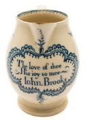 A late 18th century blue and white creamware jug: with ogee strap handle,