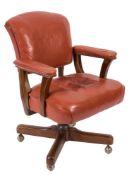 A 1950's revolving and adjustable office armchair:, with adjustable back,