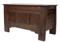 An 18th Century oak rectangular coffer:, with a plain hinged top and triple moulded panel front,