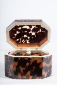 A 19th century blonde tortoiseshell tea caddy : of rectangular outline,