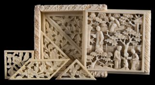 A 19th century Chinese carved ivory tangram puzzle: of square outline with sliding cover carved