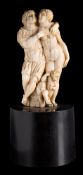 A German carved ivory group: in the form of a mythological couple,