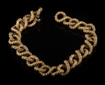 A 9ct gold bracelet: of rope textured figure of eight linking with matching integral clasp,