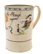 A Pratt creamware cylindrical mug: inscribed 'God speed the Plough' and painted with a large sheaf
