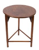 A 19th Century elm circular cricket table:, on chamfered supports, united by turned stretchers,