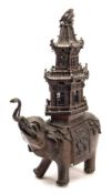 A large Japanese bronze caparisoned elephant incense burner: with detachable two-tiered pagoda