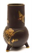 A Mintons Aesthetic movement tripod vase: decorated in the Japonesque manner imitating bronze