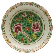 A pair of 19th Century Chinese famille rose chargers in 'Straits' style: each painted in the centre