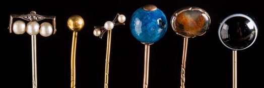 A collection of sixty-seven stick pins: with various gem-set motifs including a gold nugget,
