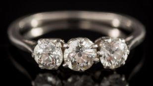 A diamond three-stone ring: with round old-cut brilliant diamonds estimated to weigh a total of 0.