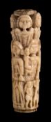 A 17th century carved ivory cutlery handle: in the form of two rows of head and shoulder female