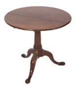 A mid 18th Century mahogany circular tea table:, the snap top on turned column and tripod supports,
