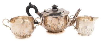 A George V hammered silver three-piece tea service, maker Goldsmiths & Silversmiths Co Ltd, London,
