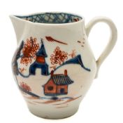 A Lowestoft sparrowbeak cream jug: with pear shaped body and loop handle,