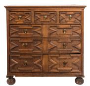 A 17th Century oak rectangular chest:, the top with a moulded edge,
