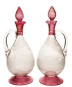 A pair of late 19th century engraved and applied glass claret jugs and stoppers: probably Stevens