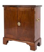 A bachelors mid 18th Century mahogany cabinet:, of rectangular shape with a hinged fold over top,
