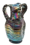 A Palme Koenig iridescent amethyst glass vase: of dimpled oviform with three scrolling crimped