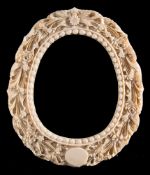 A late 19th century Cantonese carved ivory photograph frame: of oval outline,