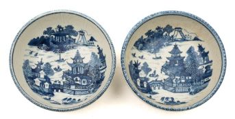A matched pair of Chinese blue and white wash-bowls: with basket moulded bands below the folded