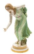 A Meissen porcelain figure of a lady bowler: modelled after the original by Walther Schott with a