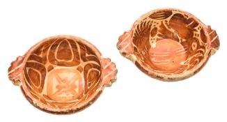 Two Hispano-Moresque copper lustre pottery bowls: with fringed leaf handles,