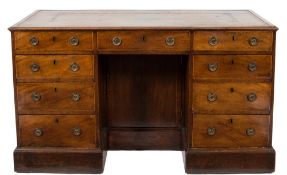 A George III mahogany and inlaid kneehole desk:, bordered with boxwood lines,