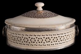 A Victorian ivory and silver mounted casket, maker Edward Brown, London, 1882: of oval outline,