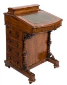 A Victorian walnut and inlaid bow-fronted Davenport:, crossbanded in tulipwood,