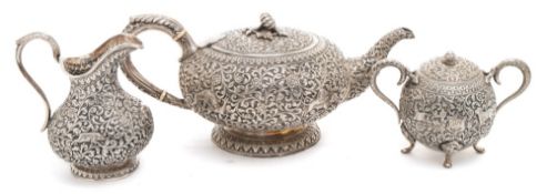 A matched Indian silver three-piece tea service.