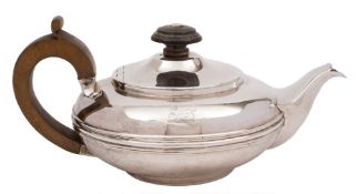 A George IV batchelor's silver teapot, maker's mark worn, London, 1824: crested,
