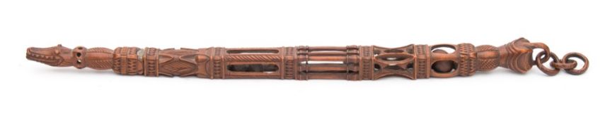 A Welsh or North Country carved treen knitting sheath: with pillared and geometric carved sections