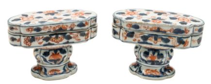 A pair of Chinese Imari spice boxes and covers: each of oval quatrefoil form with pedestal foot and