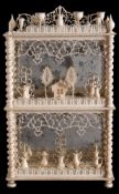 A 19th century Dieppe ivory miniature three tier dumb waiter: each shelf laden with miniature