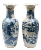 A pair of large Chinese blue and white vases: of baluster form with flared rims,