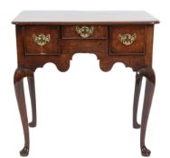 A George II mahogany lowboy:, the rectangular top with rounded corners and a moulded edge,